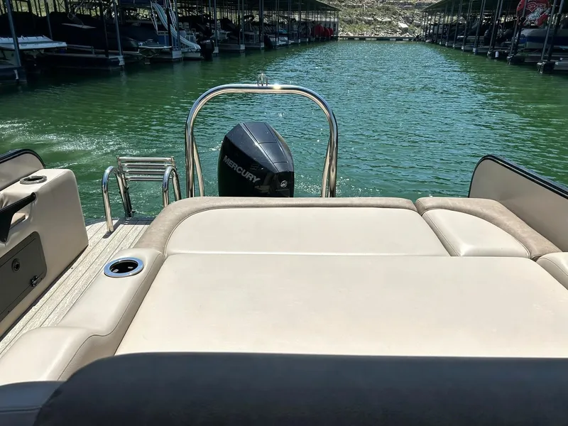 Slide: The Image of 2020 Avalon Catalina 2585 VRB boat with Mercury engine on a serene lake. - 35