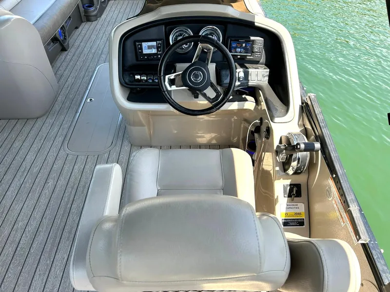 Slide: The Image of 2020 Avalon Catalina 2585 VRB boat cockpit with steering wheel and control panel. - 37