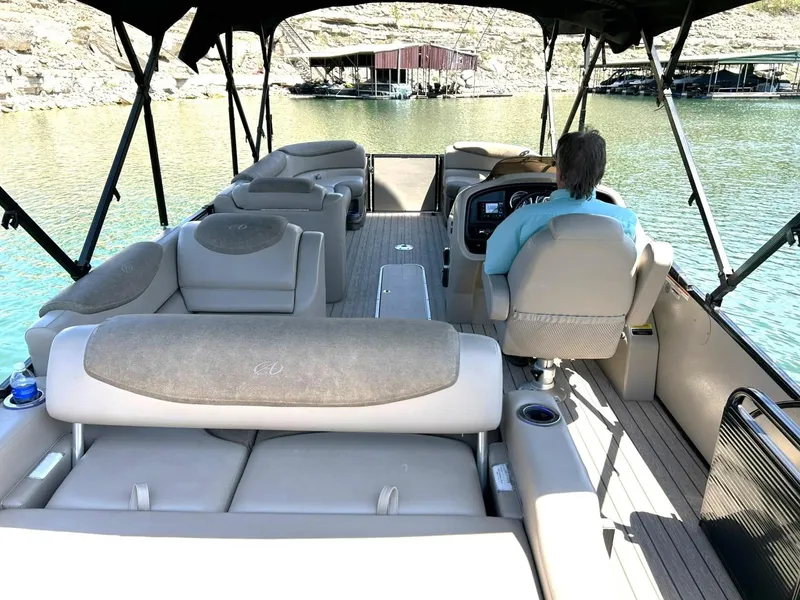 Slide: The Image of 2020 Avalon Catalina 2585 VRB pontoon boat on a lake, featuring spacious seating and canopy. - 4
