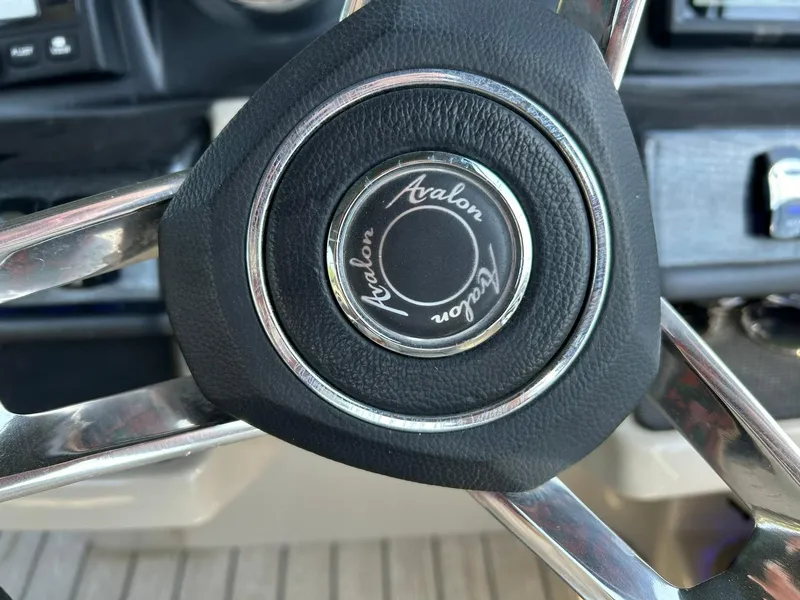 Slide: The Image of Steering wheel of 2020 Avalon Catalina 2585 VRB boat, featuring brand logo. - 41