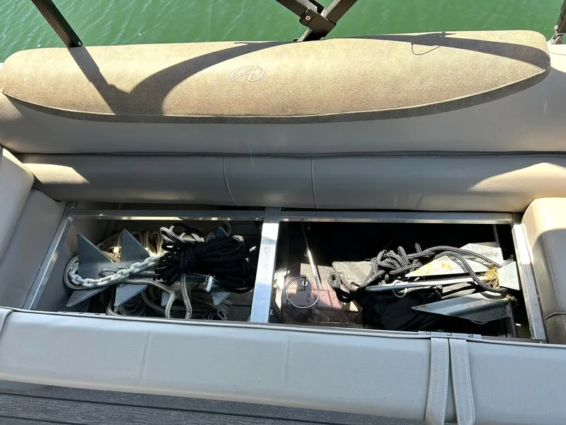 Slide: The Image of Storage compartments on a 2020 Avalon Catalina 2585 VRB boat, containing ropes and anchors. - 44