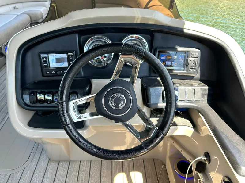 Slide: The Image of Steering console of 2020 Avalon Catalina 2585 VRB boat with modern controls and gauges. - 5