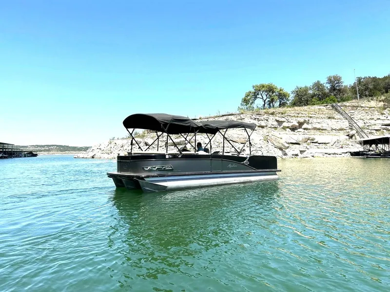 Slide: The Image of 2020 Avalon Catalina 2585 VRB pontoon boat on a serene lake. - 8