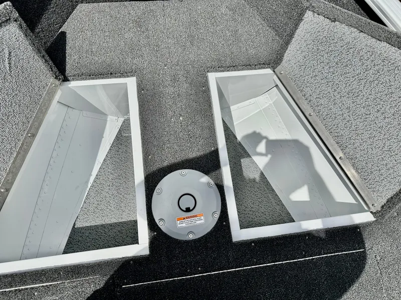 Slide: The Image of 2025 Lund 1650 Rebel XL Sport boat interior storage compartments. - 15