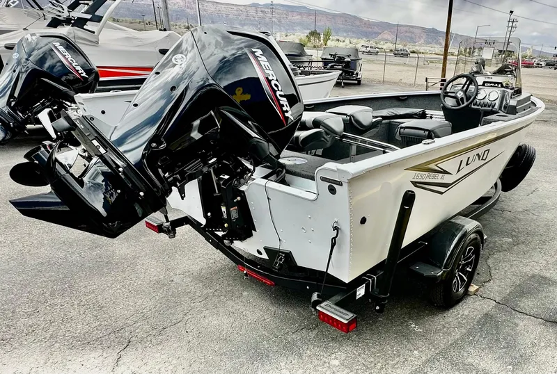 Slide: The Image of 2025 Lund 1650 Rebel XL Sport boat with Mercury outboard motor on trailer. - 3