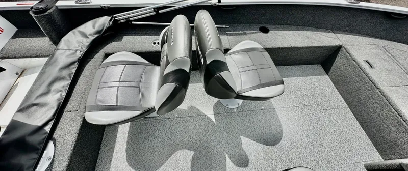 Slide: The Image of 2025 Lund 1650 Rebel XL Sport boat interior with two gray seats. - 8