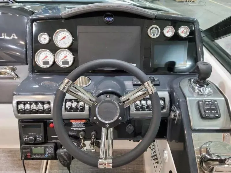 Slide: The Image of Dashboard of 2021 Formula 350 Crossover Bowrider I/O with steering wheel and controls. - 14