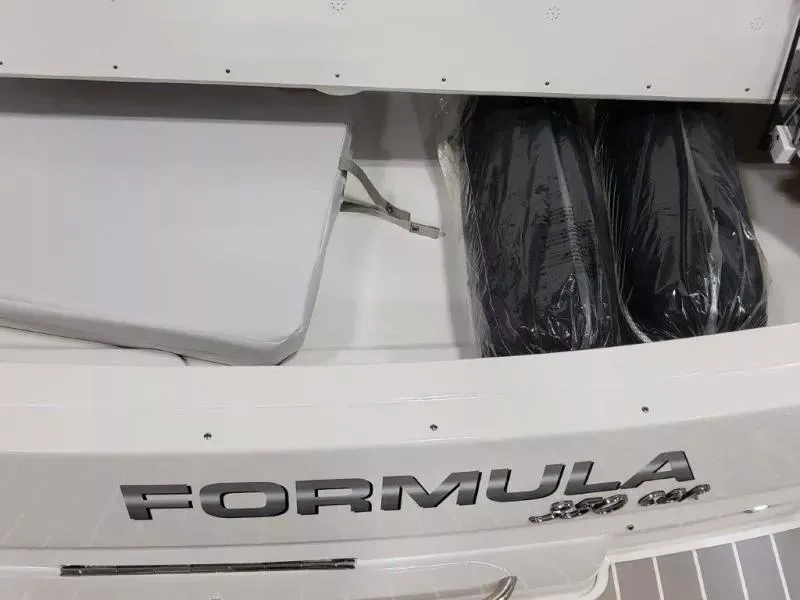 Slide: The Image of 2021 Formula 350 Crossover Bowrider I/O boat storage compartment with cushions and equipment. - 22