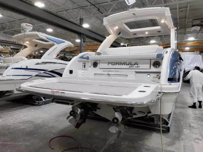 Slide: The Image of 2021 Formula 350 Crossover Bowrider I/O in a showroom, rear view. - 3