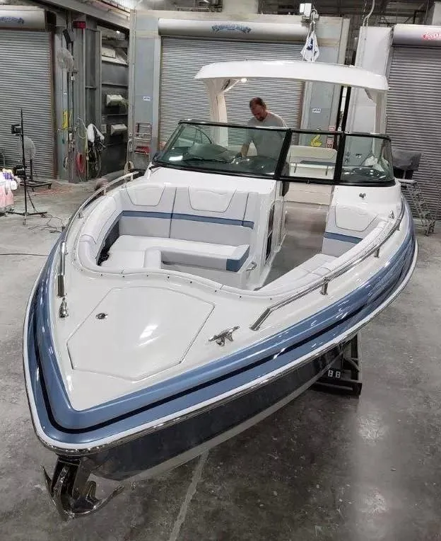 Slide: The Image of 2021 Formula 350 Crossover Bowrider I/O in a workshop setting. - 4