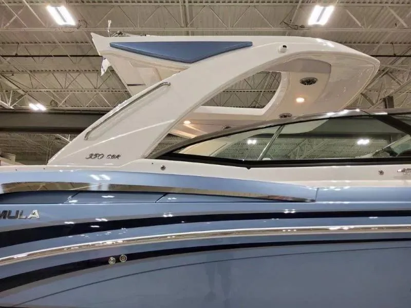 Slide: The Image of 2021 Formula 350 Crossover Bowrider I/O, sleek design, showcased indoors. - 6