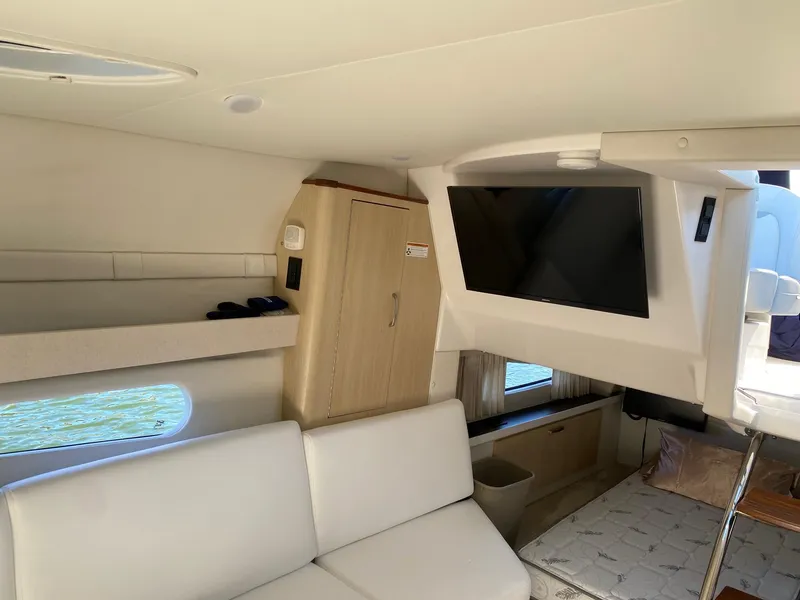 Slide: The Image of 2023 Regal 33 Express boat interior with sink, grill, and steering wheel. - 11