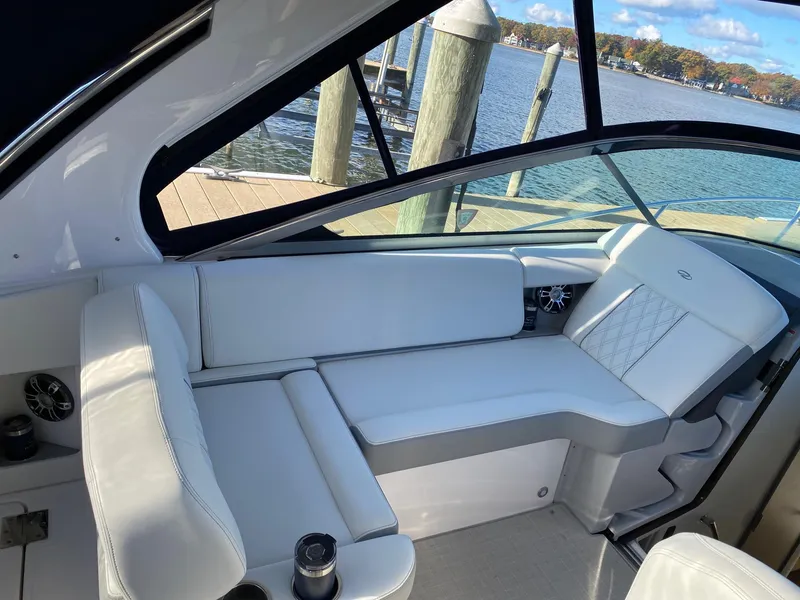 Slide: The Image of 2023 Regal 33 Express yacht in a marina storage facility, showcasing sleek design and modern features. - 4