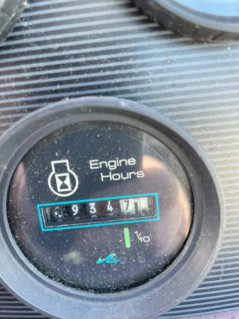 Slide: The Image of Engine hours gauge on 1990 Sea Ray 390 Express Cruiser showing 934.7 hours. - 21