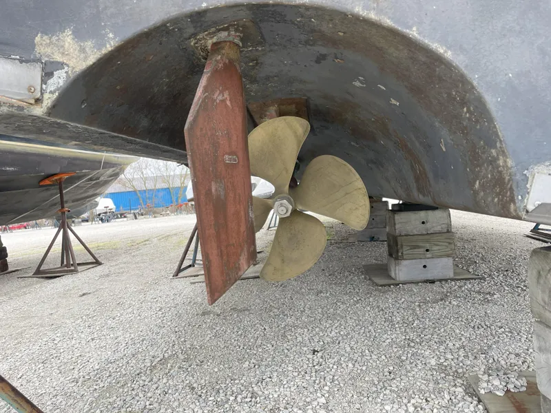 Slide: The Image of Propeller and rudder of 1990 Sea Ray 390 Express Cruiser on dry dock. - 7