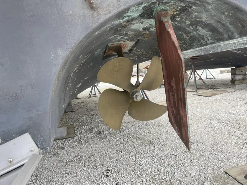 Slide: The Image of Propeller and rudder of a 1990 Sea Ray 390 Express Cruiser on dry dock. - 8