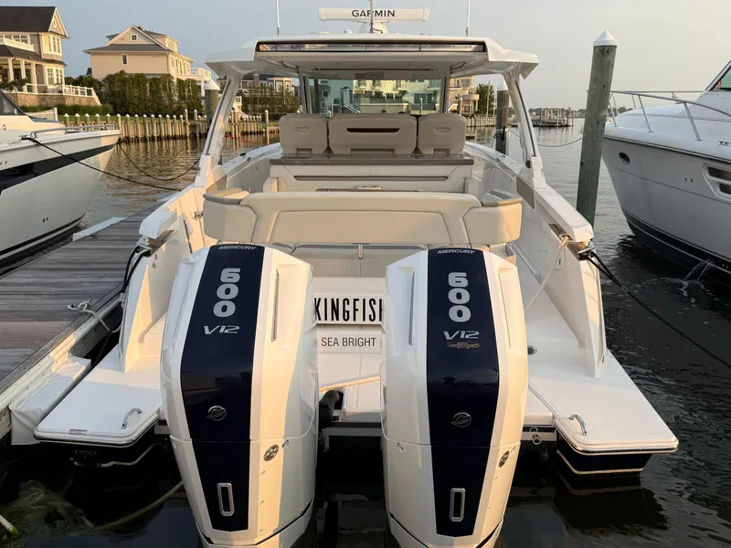 Slide: The Image of 2023 Tiara Yachts 43 LS with dual 600 V12 engines docked at marina. - 19