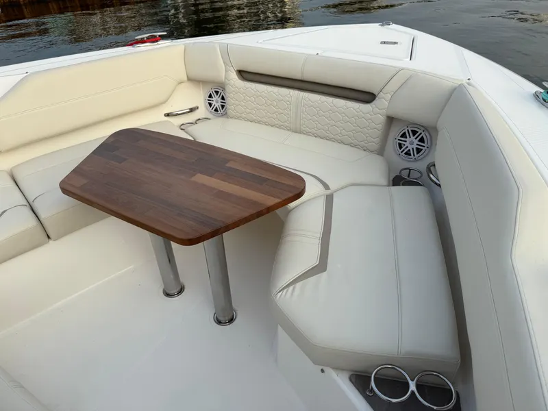 Slide: The Image of Luxurious seating area on 2023 Tiara Yachts 43 LS with elegant wooden table. - 30