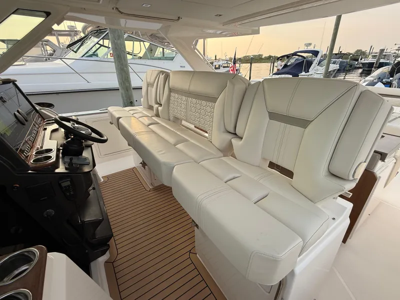 Slide: The Image of Luxurious interior of 2023 Tiara Yachts 43 LS with plush seating and modern helm. - 31