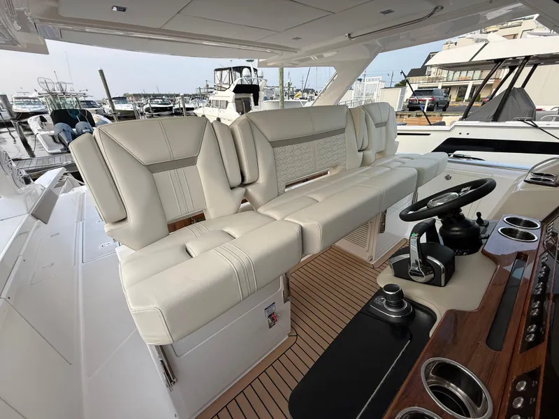 Slide: The Image of 2023 Tiara Yachts 43 LS interior with luxurious seating and modern helm controls. - 32