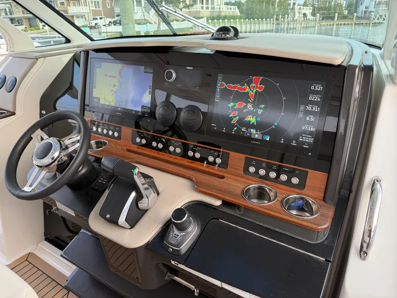 Slide: The Image of 2023 Tiara Yachts 43 LS helm with advanced navigation displays and controls. - 33