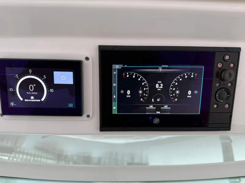 Slide: The Image of Dashboard of 2023 Tiara Yachts 43 LS with digital displays and controls. - 36