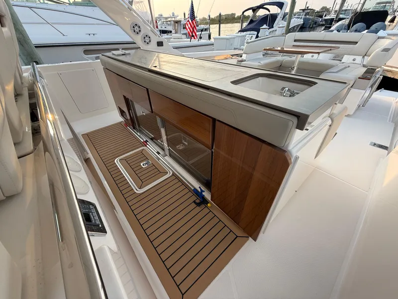 Slide: The Image of 2023 Tiara Yachts 43 LS luxury yacht deck with sleek design and modern amenities. - 40