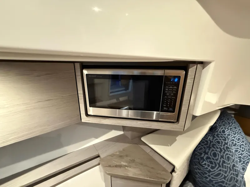 Slide: The Image of Modern microwave in 2023 Tiara Yachts 43 LS interior, sleek design and compact space. - 50