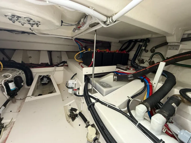 Slide: The Image of Engine compartment of 2023 Tiara Yachts 43 LS, showcasing wiring and components. - 60