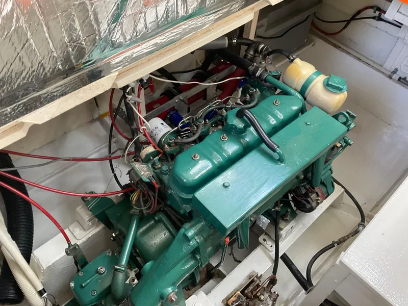Slide: The Image of Engine compartment of a 1980 Kanter Staysail Cutter, showcasing a well-maintained marine engine. - 33