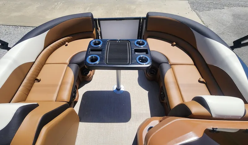Slide: The Image of 2024 Avalon LSZ 2385 Rear Lounger with tan seating and central table. - 7