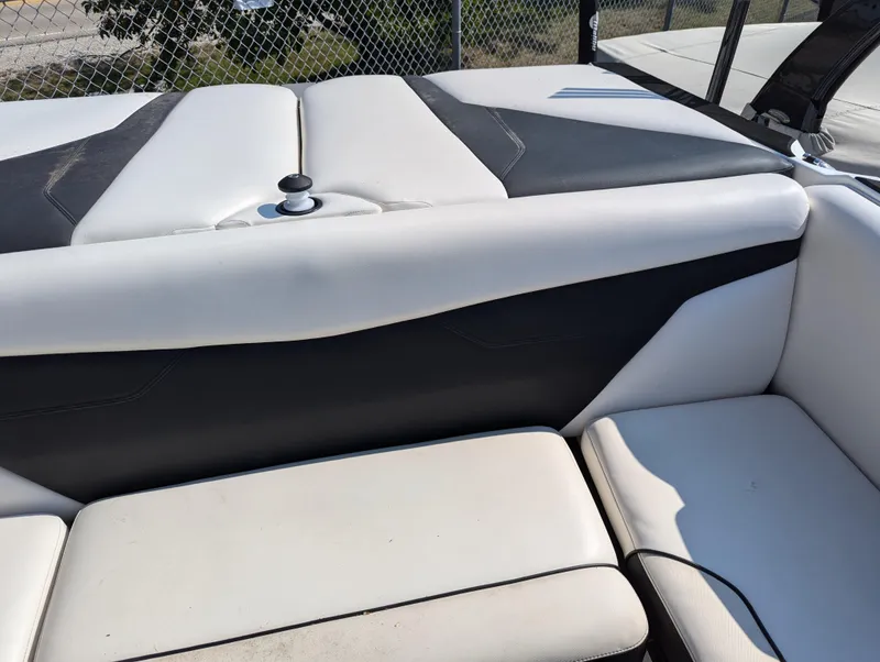 Slide: The Image of 2019 Axis A22 boat interior with white and black seating. - 14
