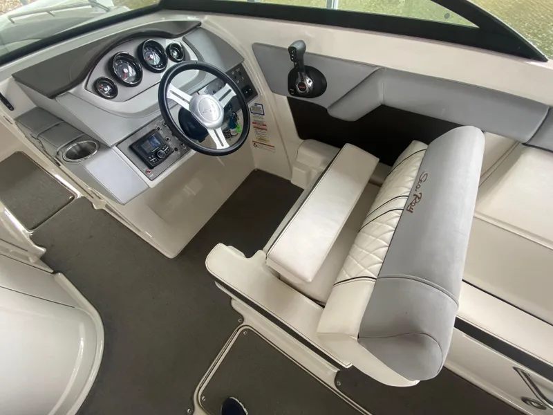 Slide: The Image of Interior view of 2017 Sea Ray 270 SDX OB boat cockpit with steering wheel and seating. - 22