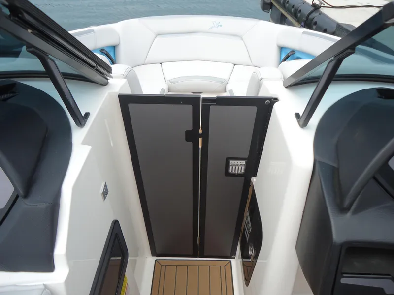 Slide: The Image of 2021 MasterCraft XStar boat interior with sleek design and modern features. - 10