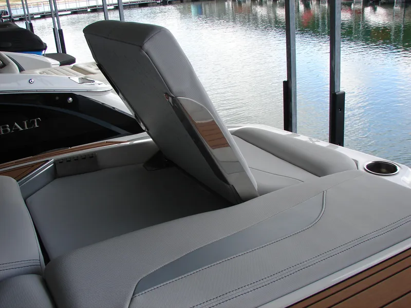 Slide: The Image of 2021 MasterCraft XStar boat with adjustable seating on a calm waterfront. - 11