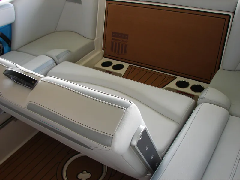 Slide: The Image of Luxurious interior of 2021 MasterCraft XStar boat with white seating and cup holders. - 15