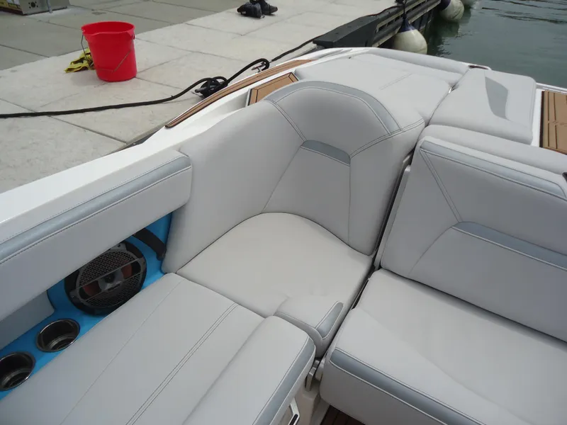 Slide: The Image of 2021 MasterCraft XStar boat interior with white seating and speaker detail. - 22