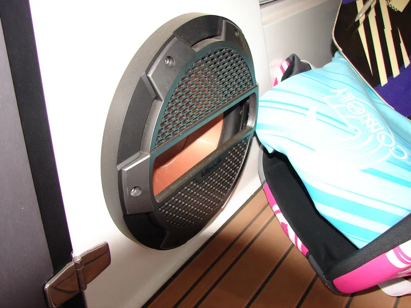 Slide: The Image of 2021 MasterCraft XStar boat interior with speaker and colorful life jacket. - 33