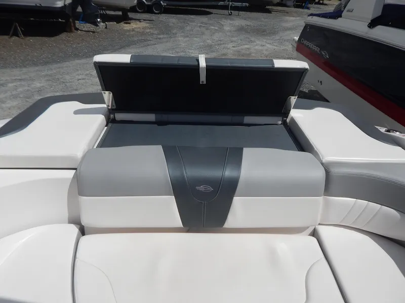 Slide: The Image of 2021 Chaparral 23 SSi boat interior with open storage compartment. - 17