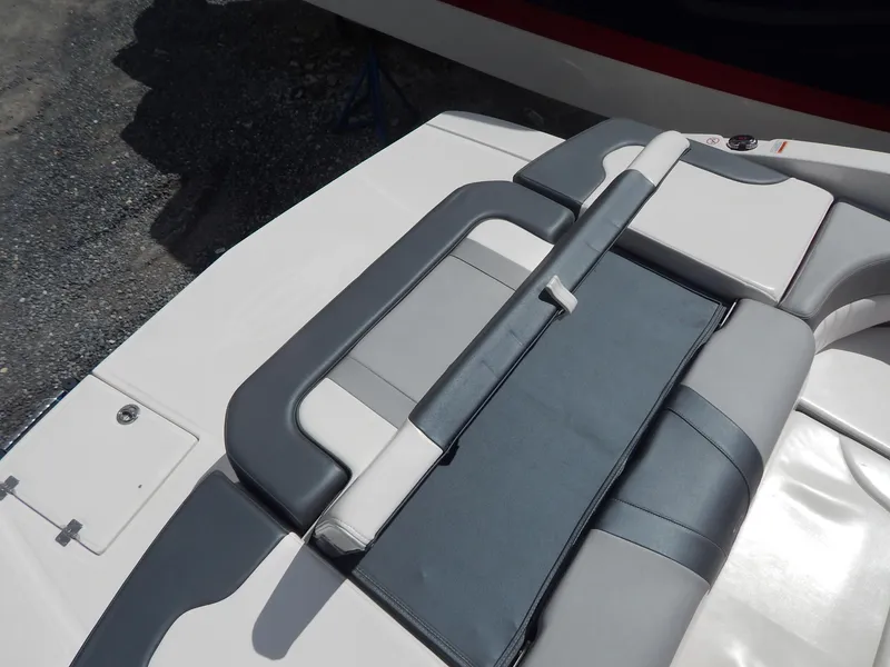 Slide: The Image of 2021 Chaparral 23 SSi boat seating area with gray and white upholstery. - 18