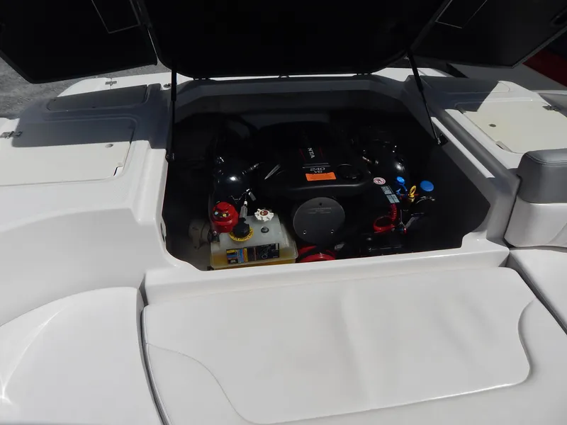 Slide: The Image of 2021 Chaparral 23 SSi boat engine compartment with open hatch. - 24