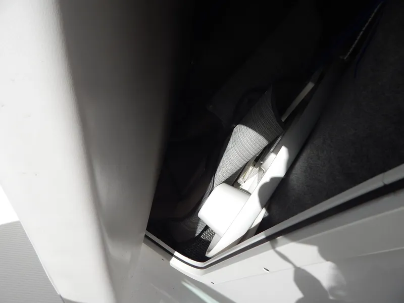 Slide: The Image of Storage compartment in 2021 Chaparral 23 SSi boat, featuring interior details and materials. - 26