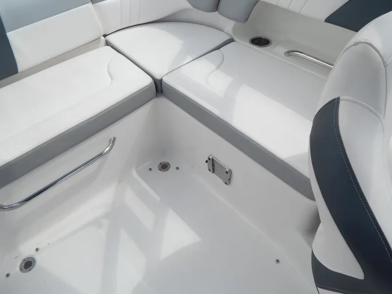 Slide: The Image of 2021 Chaparral 23 SSi boat interior with white and gray seating. - 29