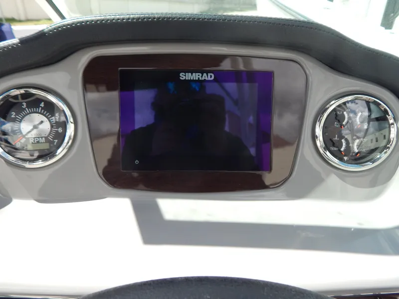 Slide: The Image of Dashboard of 2021 Chaparral 23 SSi with Simrad display and RPM gauges. - 31