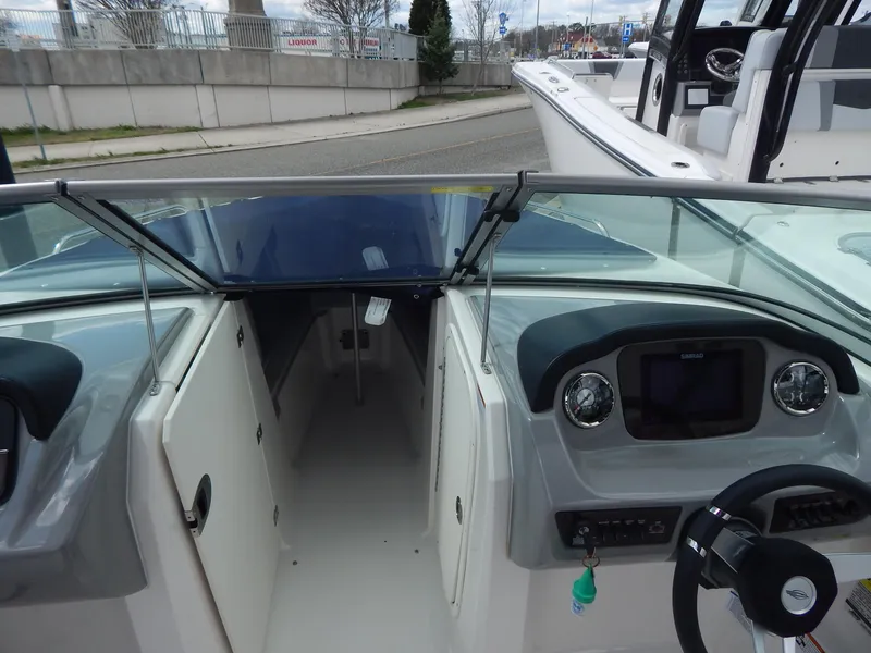 Slide: The Image of 2021 Chaparral 23 SSi boat interior with dashboard and steering wheel. - 8