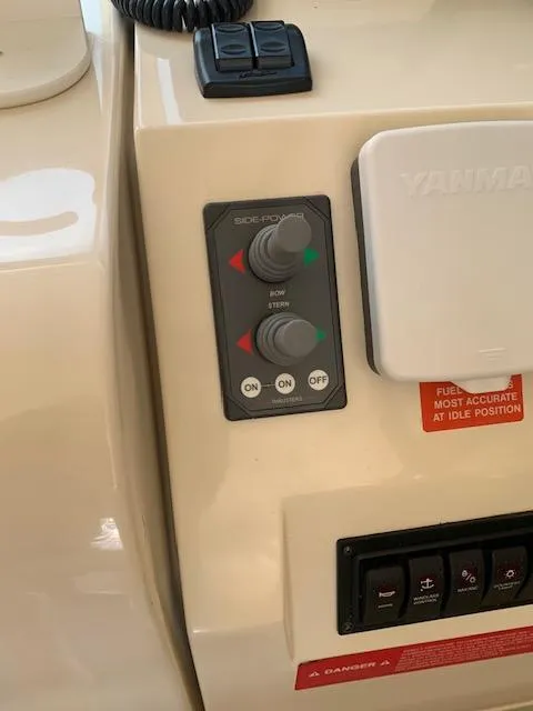 Slide: The Image of Control panel of a 2008 Mainship Pilot 34 boat with switches and indicators. - 17