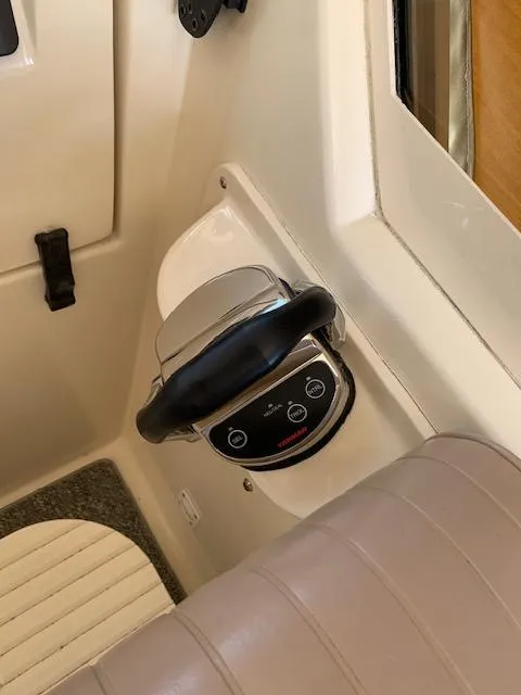 Slide: The Image of 2008 Mainship Pilot 34 boat interior with control panel and seating. - 18