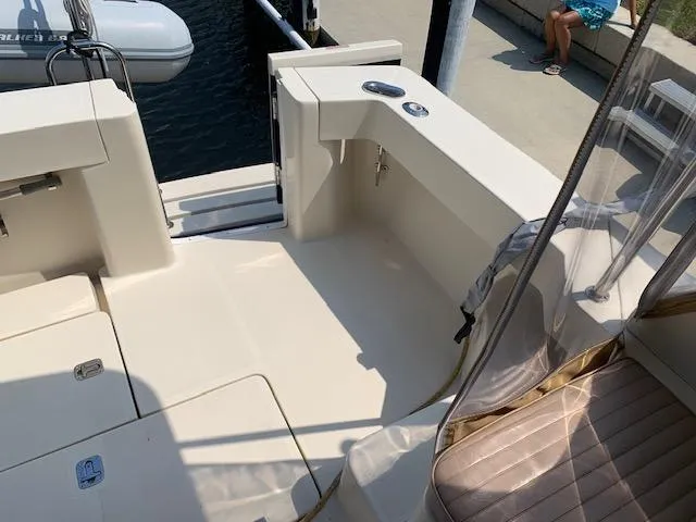 Slide: The Image of 2008 Mainship Pilot 34 boat deck with seating and dock view. - 20