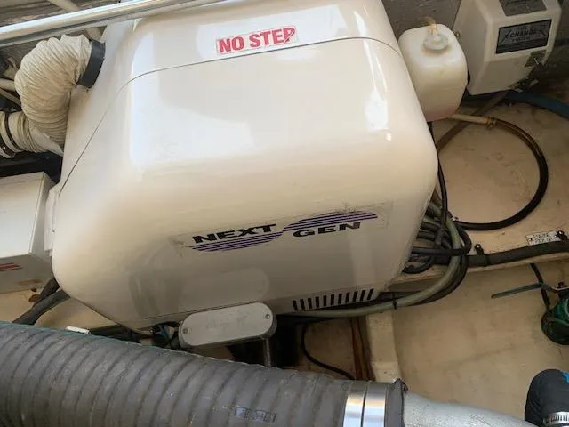 Slide: The Image of Engine compartment of a 2008 Mainship Pilot 34 with Next Gen generator. - 24