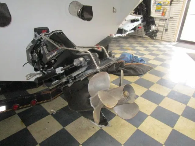 Slide: The Image of 2001 Baja 292 Islander boat propeller and drive system on checkered floor. - 22